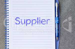 Supplier write on notebook