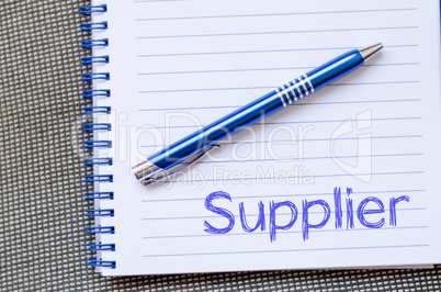 Supplier write on notebook