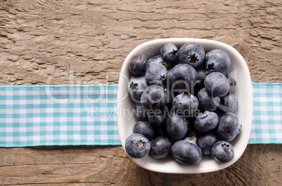 Fresh blueberries on wood