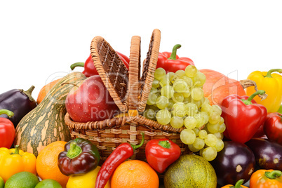 vegetables and fruits in a basket isolated on white background