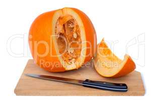 Ripe cut the pumpkin on a white background.