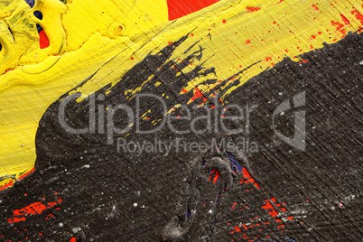 Brushstroke - yellow,black and red paint  on metal surface