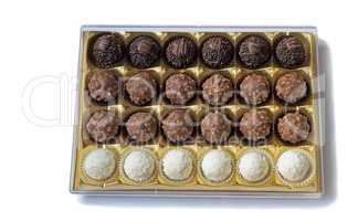 Chocolate sweets in the box on the white background.
