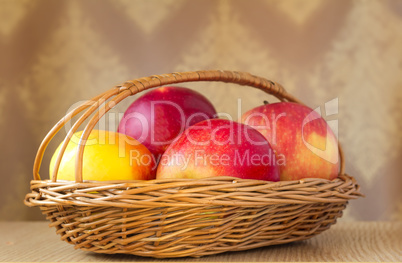 Large apples in a wattled basket.