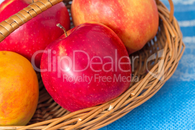Large apples in a wattled basket.