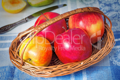 Large apples in a wattled basket.