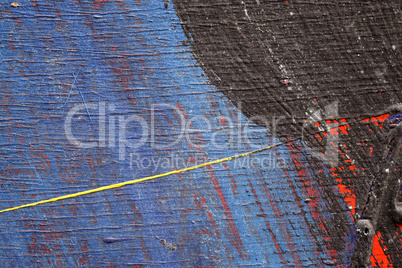 Brushstroke - yellow,blue,black and red paint  on metal surface