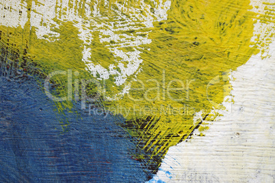 Brushstroke - yellow,blue,black and white paint  on metal surfac
