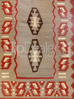 Close up of a hanged colourful handmade traditional wool rug