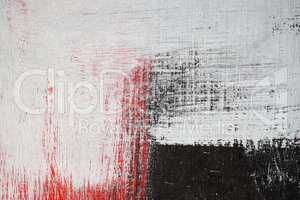 Brushstroke with white,black and red paint  on dusty metal