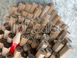 Close up of identical graphite pencils and one different red  cr