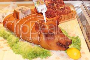 cooked pig is sold in the grocery store