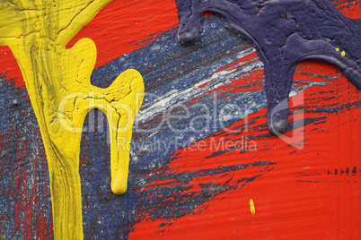 Yellow, blue and red acrylic paint  on  metal surface