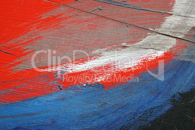 Brushstroke - white, blue and red acrylic paint  on  metal surfa