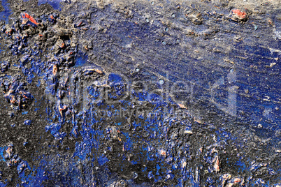Hoarse, scratched and peeled surface  with blue and black paint