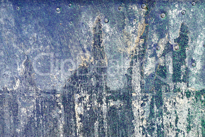 Hoarse,scratched and peeled surface with green and blue paint