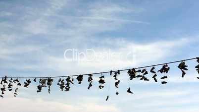 Shoes hang on a rope