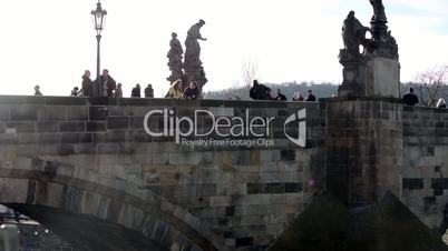 Charles Bridge with people and Vltava river