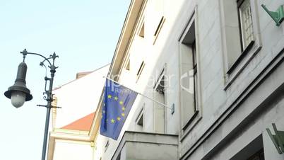 European Union Flag hanging on the state building and security cameras