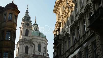 St. Nicholas Church (Mala Strana) with other buildings with the street