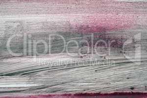 Brushstroke with black and red paint  on dusty metal fence