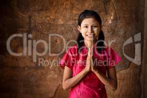 Young Myanmar girl praying