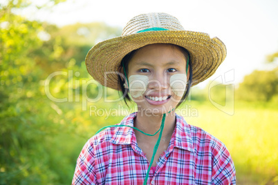Traditional young Burmese female farmer