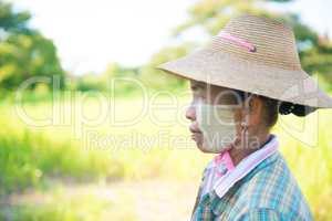 Traditional mature Myanmar female farmer