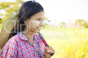 Traditional young Asian Myanmar female farmer