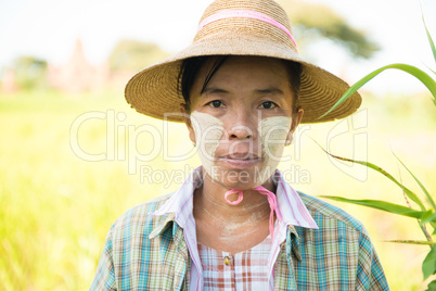 Traditional mature Asian female farmer