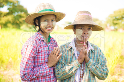 Traditional Myanmar female farmers greeting
