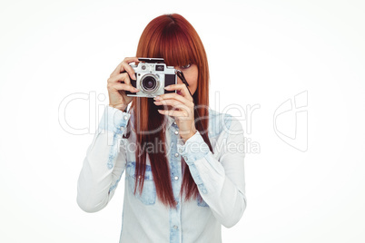 Attractive hipster photographing with camera