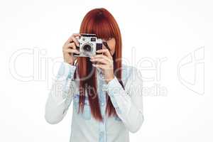 Attractive hipster photographing with camera