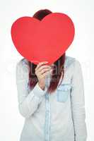 Attractive hipster woman behind a red heart