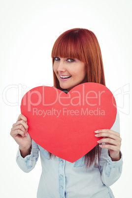 Attractive hipster woman behind a red heart