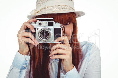 Attractive hipster photographing with camera