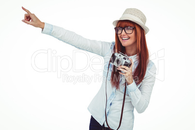 Attractive hipster photographing with camera