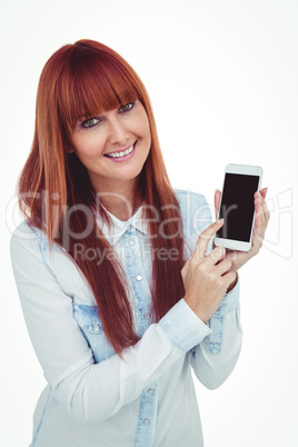 Smiling hipster woman showing her smartphone Smiling hipster woman showing her smartphone