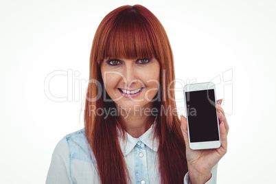 Smiling hipster woman showing her smartphone