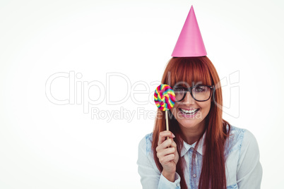 Pretty hipster woman with hat party and lollipop