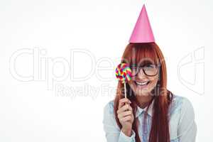 Pretty hipster woman with hat party and lollipop