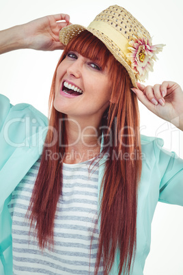 Portrait of a smiling hipster woman wearing hat