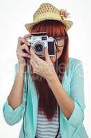 Portrait of a smiling hipster woman holding retro camera