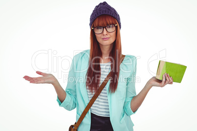 Smiling hipster woman with bag and book