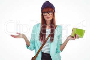 Smiling hipster woman with bag and book