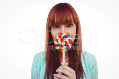 Smiling hipster woman with a lollipop