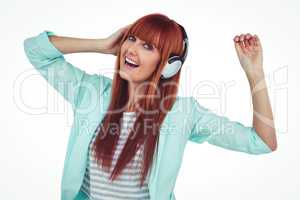 Happy hipster woman listening music with headphone