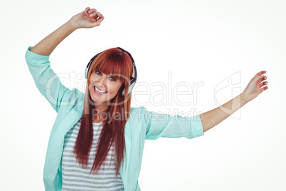 Happy hipster woman listening music with headphone