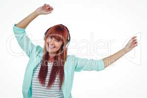 Happy hipster woman listening music with headphone