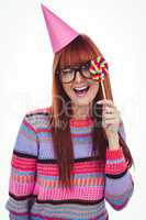Smiling hipster woman with lollipop and hat party